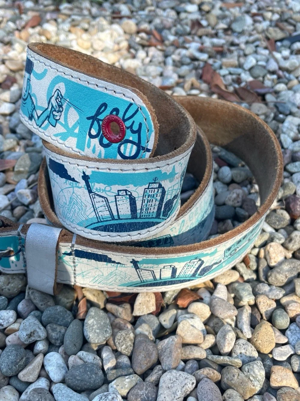 Vintage 80s blue and white FFLY Hope project leather belt with silver buckle.